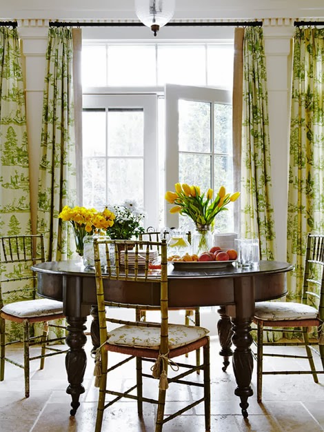 Dining room with vintage faux bamboo chairs, green toile curtains in a traditional dining room