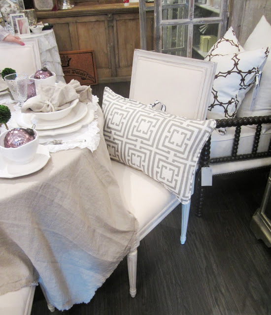 COCOCOZY Logo pillow in grey on a dining chair at PomPom Interiors