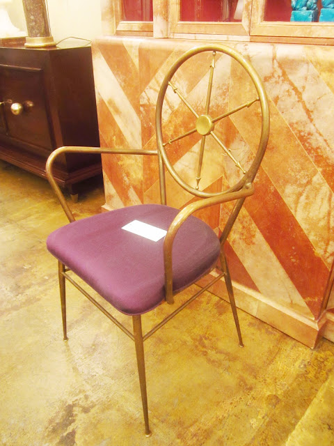 brass chair with a purple cushion