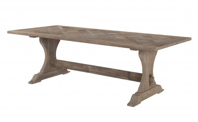 Rustic kitchen table made of reclaimed elm with a natural smoked wood finish