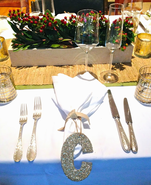 Holiday table setting with straw runner and Christofle flatware
