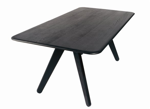Black slab dining room table made of lacquered oak