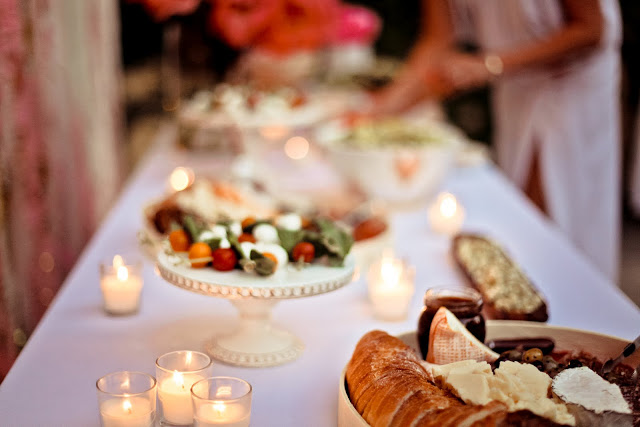  hors d'oeuvres, cheeses and vegetables spreads with votive candles
