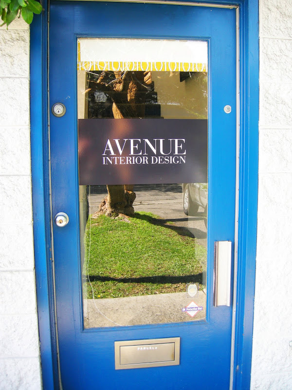 Bright blue front door to Avenue Interior Design
