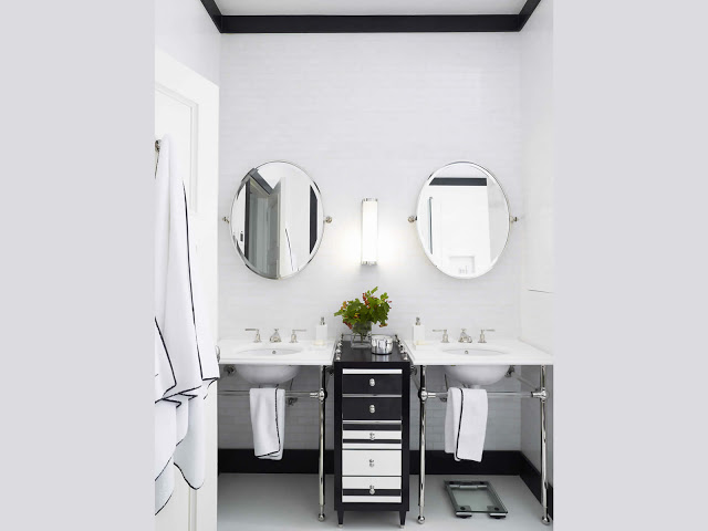 his her bathroom sink oval mirrors basin marble white tile black baseboard