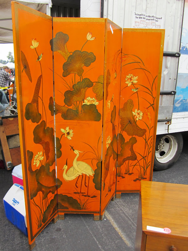 Orange lacquer painted wood screen with crane landscape