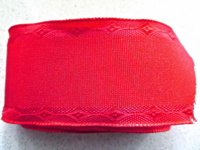 Red wire grosgrain ribbon with an embossed pattern