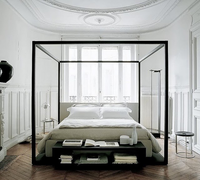 Black and white bedroom with herringbone wood floor