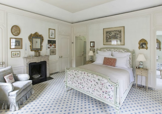 Bedroom in a NYC townhouse with Louis style bed and delicate floral patterns