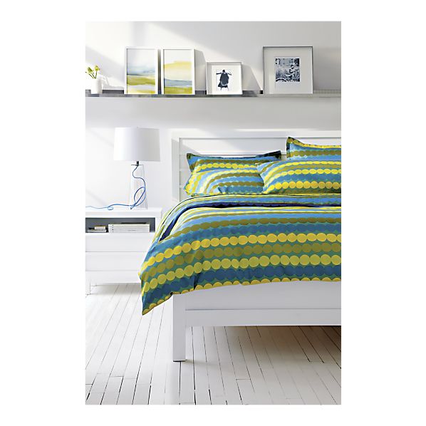 Marimekko Rasymatto Teal Bed Linens in a white bedroom
