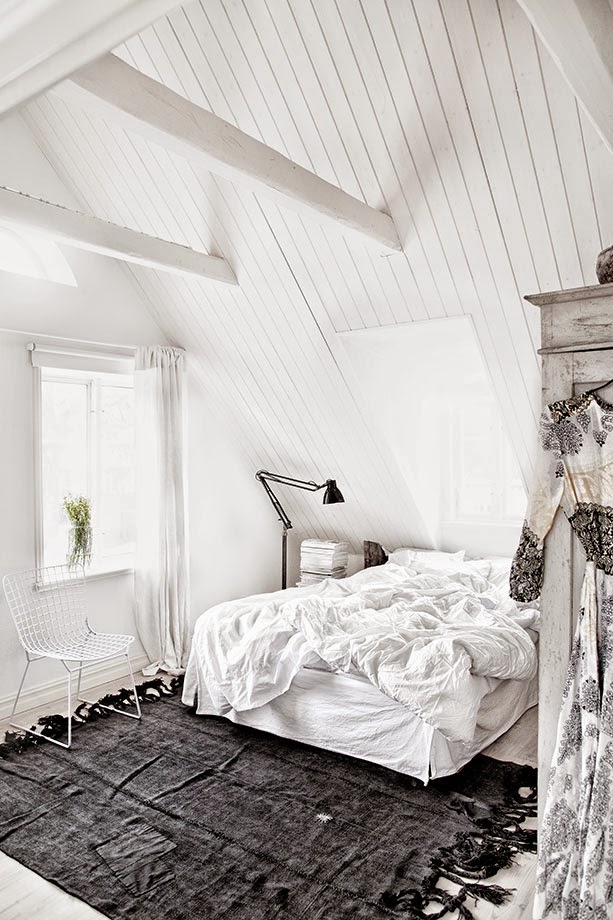 White bedroom with black accents in Jenny Hjalmarsson Boldsen's home