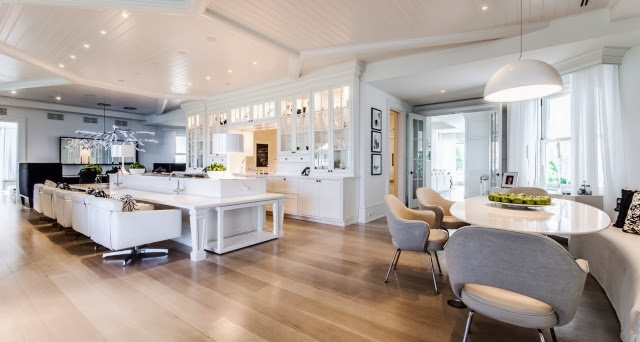 Kitchen and Dining room in Celine Dion's home with light wood floor and modern furniture