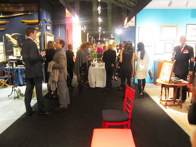People mingling at the Young Collectors Night at the Winter Antiques Show at the Armory
