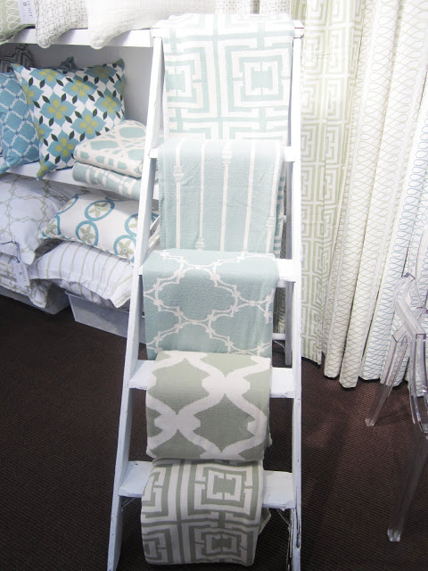 COCOCOZY throws displayed on a ladder at the New York International Gift Fair