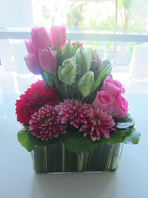 flower arrangement with pink tulips and roses and other red and pink flowers