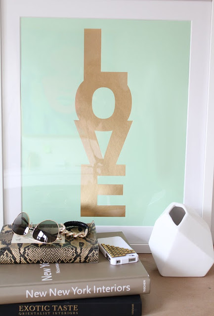 Letter press print on mint green paper with LOVE written in gold