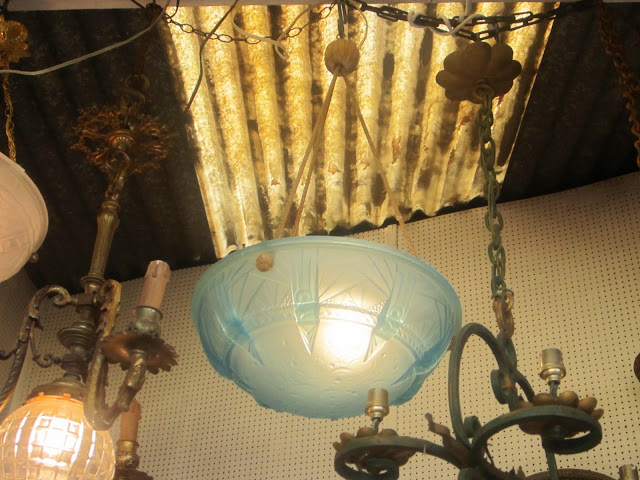 Close up of the blue frosted crystal glass bowl shaped chandelier