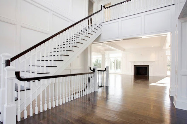 foyer with a grand staircase and wood floor