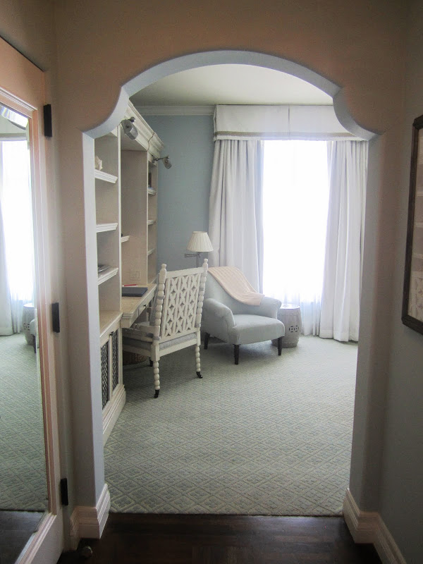 Guest room in Casa del Mar in Santa Monica with hard wood floor, carpeting , a desk with a wood chair and an armchair