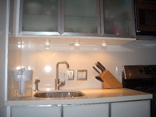 Kitchen after remodel with Porcelanosa backsplash with undercounter lights