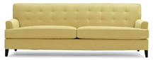 Cream tufted sofa from MITCHELL GOLD & BOB WILLIAMS