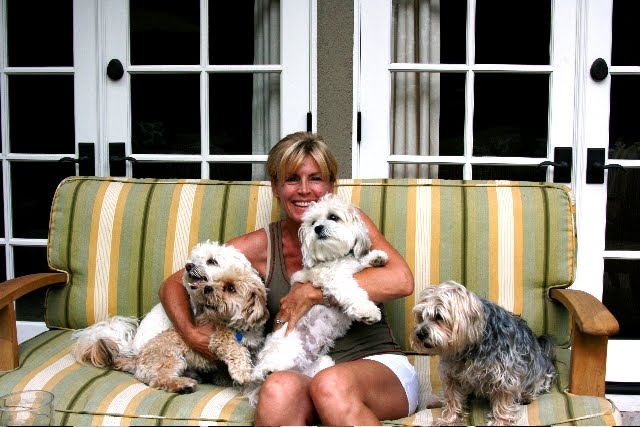 Linda Grasso of Shesez relaxing on her patio with her dogs