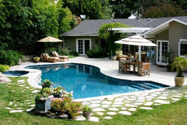 Linda Grasso of Shesez's California backyard with a pool and outdoor living room