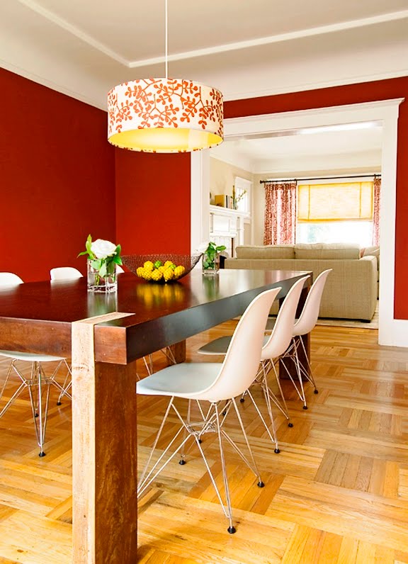 Dining room after Niche Interiors' redesign with red paint, modern farmhouse style dying table and a hand painted chandelier