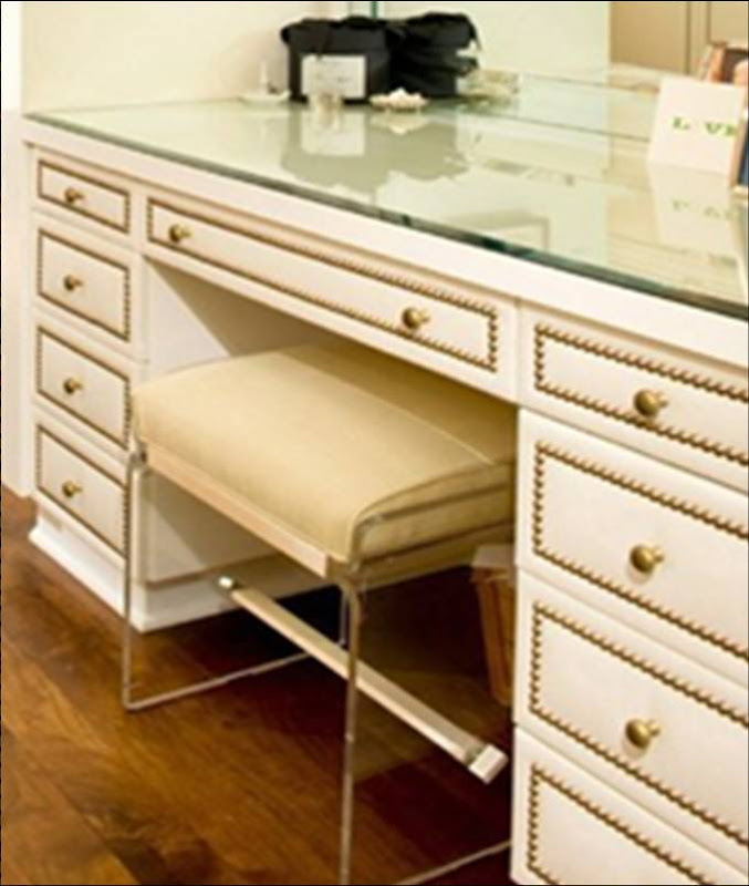 Close up of built in vanity drawers in a dressing room by Todd Nickey and Amy Kehoe with nailhead trim