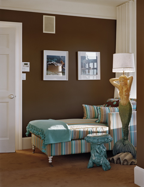 Brown and turquoise bedroom by Ghislaine Vinas with a striped chaise lounge chair and a mermaid lamp