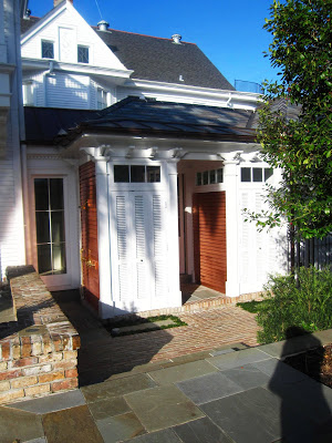 Guest house at the Wedding Cake House in New Orleans with copper siding on the Portico