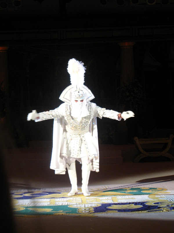 Man in white with a mask at the presentation ceremony for the 70th King of Hermes and his court at the Hermes Grand Ball