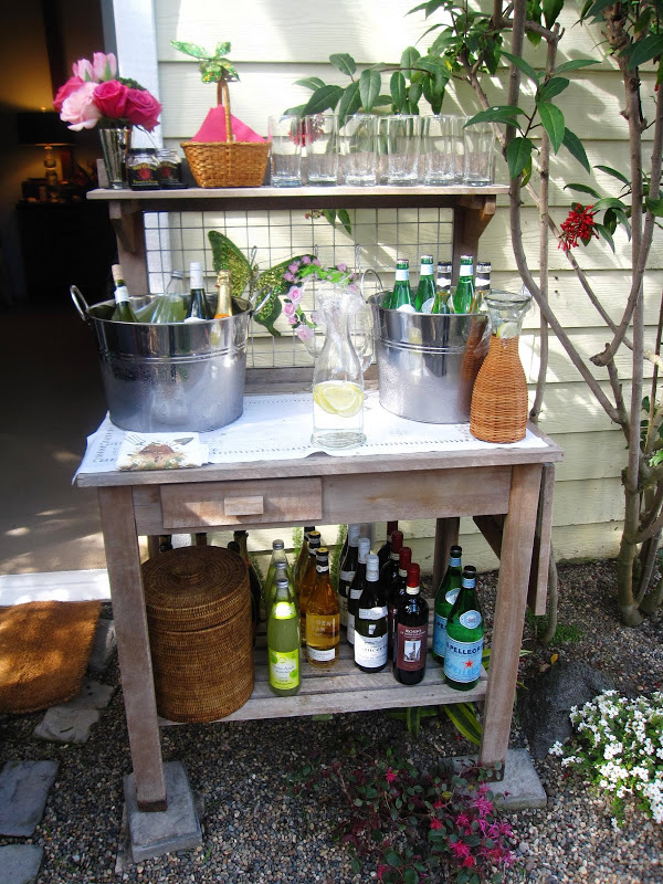 Garden potting table is transformed into a well appointed bar at a baby shower