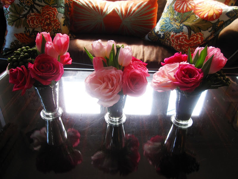 Pink tulips and roses in a trio of silver Mint Julep cups on a table at a baby shower