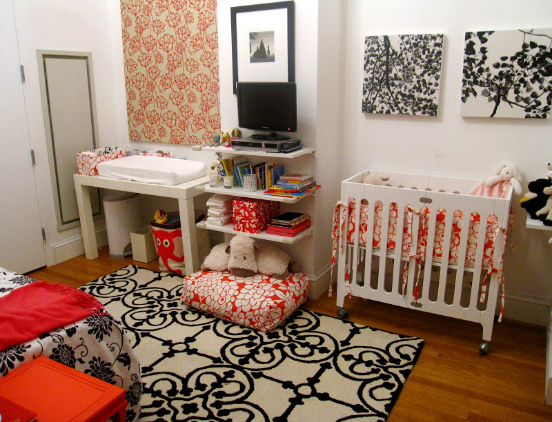 Colorful nursery in an NYC loft with stylish prints and florals
