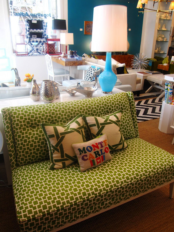 Jonathan Adler Capri Bottle lamp and a green and cream graphic print sofa