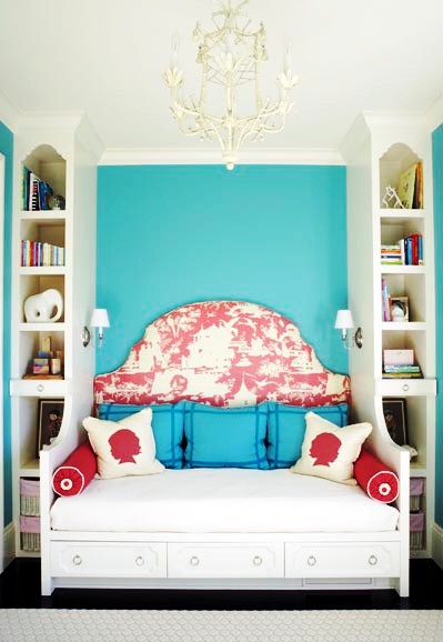 Bedroom with white tole faux bamboo chandelier, a daybed with rose and white tolie headboard and a turquoise painted wall