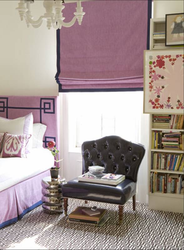 Posh bedroom with purple headboard and Roman shades with a dark ribbon trim