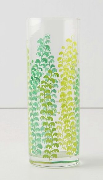 Tall clear glass jar with a vine design in different shades of green