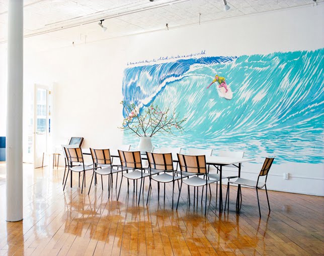 Modern dining room with a mural of a surfer by ngoc minh ngo