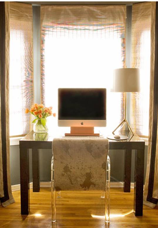 Home office and study by Kristen Hutchins with blue grey walls, gold desk lamp, sheer curtains and a dark wood parsons desk