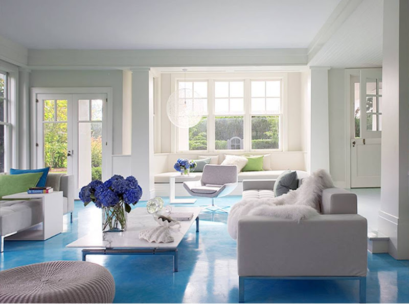 White living room with a bright blue floor
