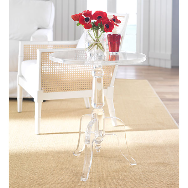 Acrylic Side Table modeled after an 18th Century European table holding a flower arrangement of red poppies and a red cup