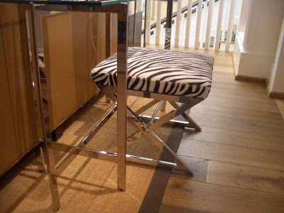 Silver x-bench with zebra print seat
