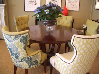 Dining vignette with tufted dining chairs with nail head trim and patterned upholstered back from Plush Home