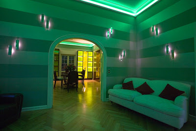 Living room with mood lighting and striped walls