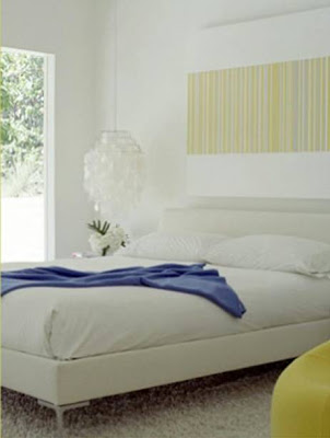 Bedroom with a white upholstered bed