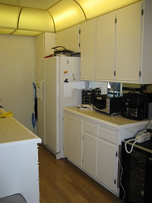 Small kitchen before remodeling with white cabinets and counter tops