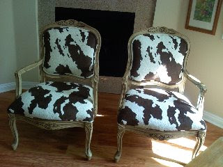 Two Louis XV style chairs after reupholstering in brown and white cow hide fabric