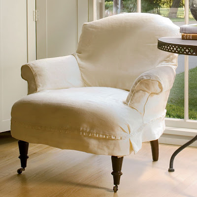 Armchair with white linen slip clover and casters from Wisteria